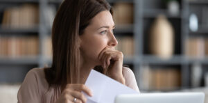 Stressed out woman contemplating bankruptcy